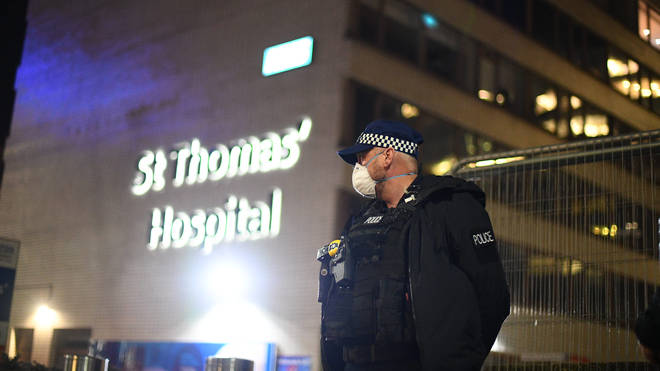 A police officer stands guard outside St Thomas' Hospital