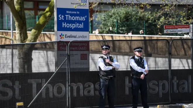 Police officers are seen outside St Thomas' Hospital on April 7, 2020