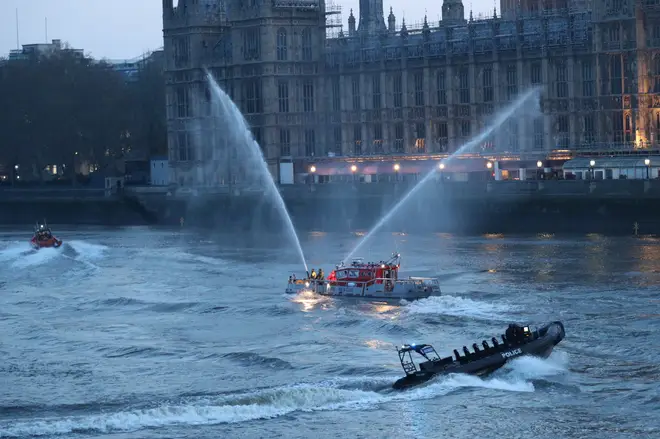 Members of the emergency services on the River Thames near St Thomas' Hospital in Westminster