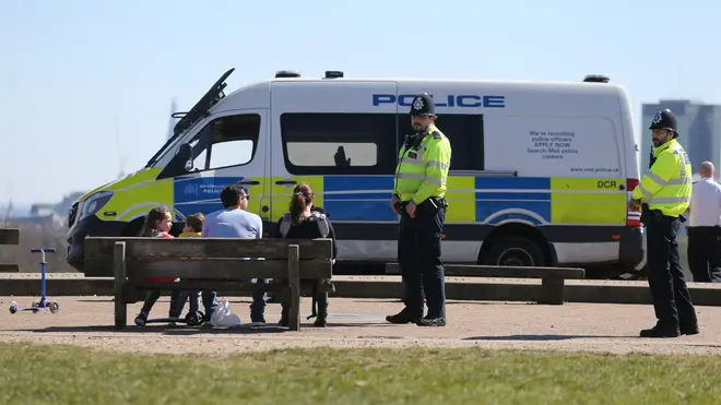Police move on sunbathers at Primrose Hill, north London