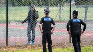 Police ask a man to stop playing tennis during the lockdown