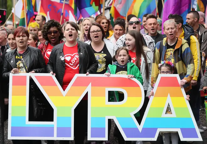 Sara Canning (front centre left), partner of murdered journalist Lyra McKee, marching with protesters through Belfast city centre demanding same sex marriage in Northern Ireland.