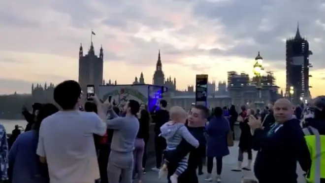 People gathered together on Westminster Bridge to clap for carers