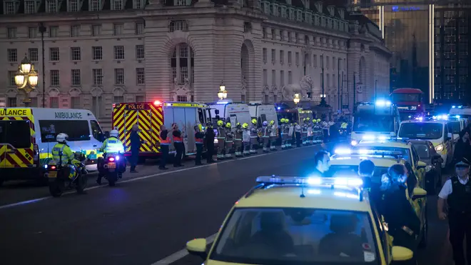 Emergency services lit up the London skyline with blue lights