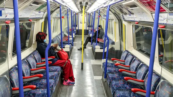 File photo: Passengers wear face masks on the London Underground