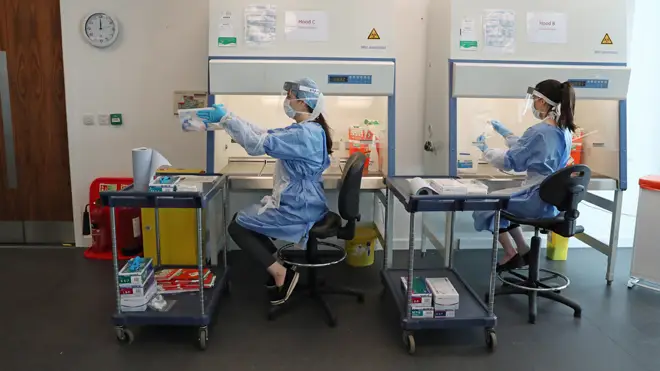 Scientists work at the Lighthouse Laboratory in Glasgow which receives and analyses coronavirus swabs taken from NHS staff and frontline workers