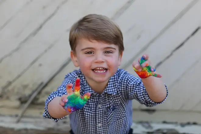 Prince Louis lights up the screen playing with rainbow paints