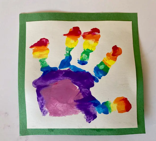 The young royal made a handprint with the paints