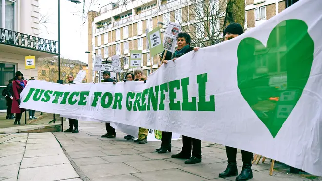 Protesters outside the Grenfell Tower public inquiry in London