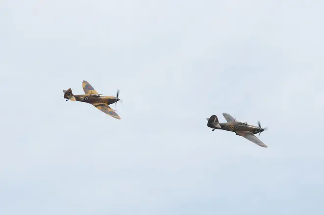 A Battle of Britain Memorial Flight flypast of a Spitfire and a Hurricane passes over the home of Second World War veteran Captain Tom Moore