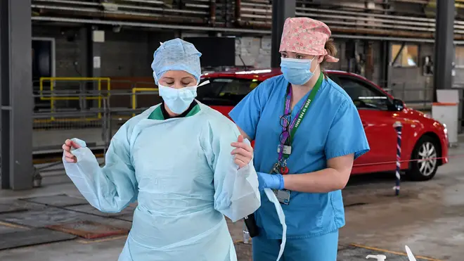Nurses wear PPE at a testing site in the Republic