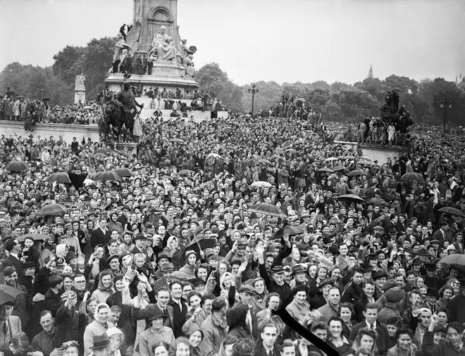 Some of the crowd pictured outside Buckingham Palace