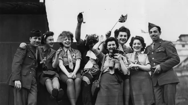 A group of ATS and American soldiers celebrate VE Day in Trafalgar Square