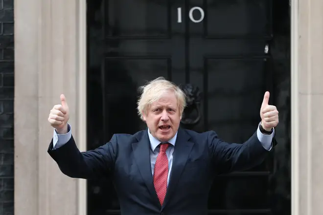 Boris Johnson stood outside Downing Street to join the applause