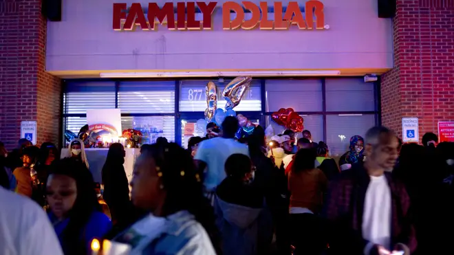 A vigil outside the supermarket fore Calvin Munerlyn, the security guard who was shot dead