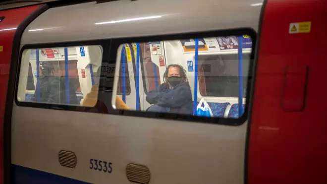 A Tube passenger wears a face mask on the Northern Line