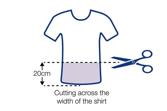 Cut a straight line across the width of the T-shirt