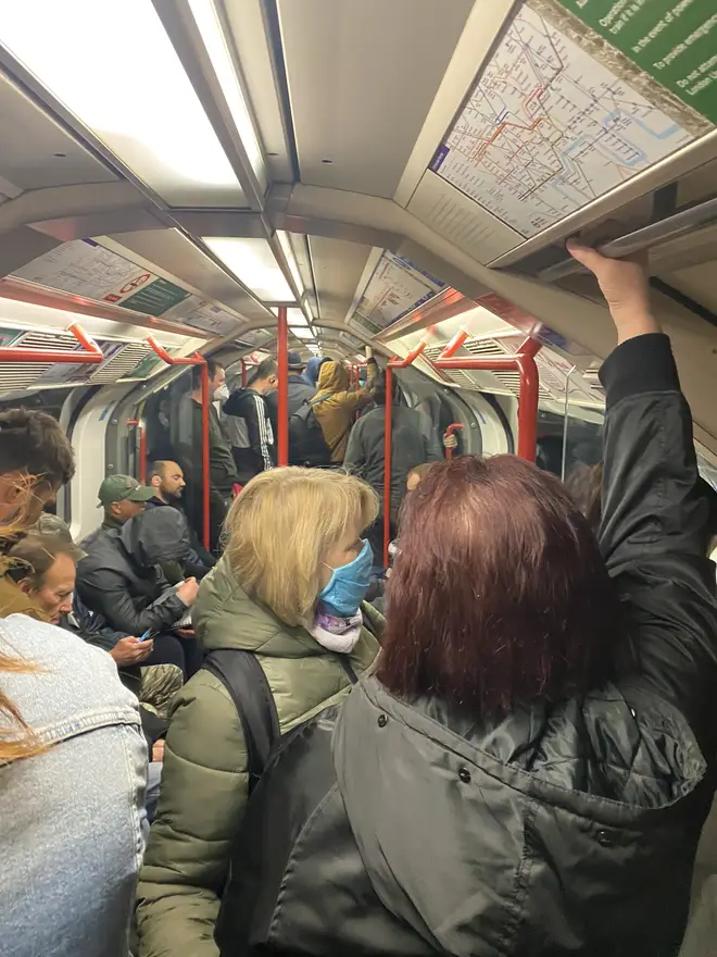 Commuters crowd inside a tube train on the London Underground on Thursday