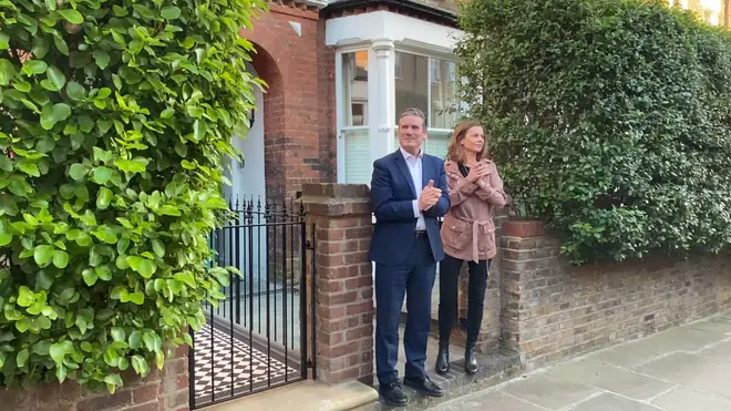 Labour leader Sir Kier Starmer and his wife Victoria outside their home, as they join in the applause