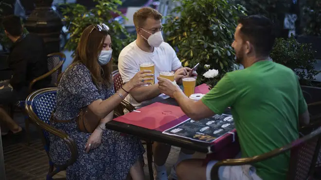 People in a bar terrace in Barcelona, on May 25, 2020