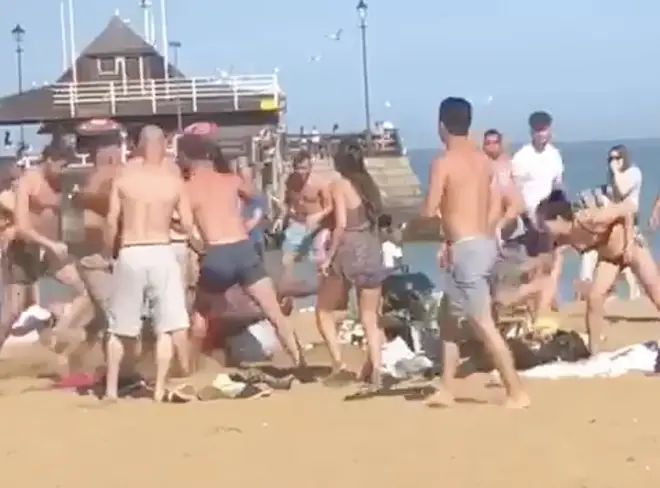 Sunseekers were left stunned as the large fight broke out at about 4pm
