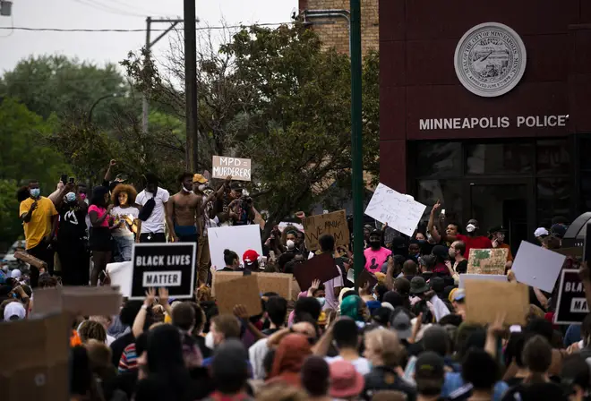 Protesters gathered outside the police station where the officers involved are believed to have worked