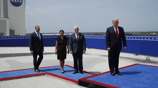 Donald Trump and the Vice President and Second Lady take their places to watch the launch