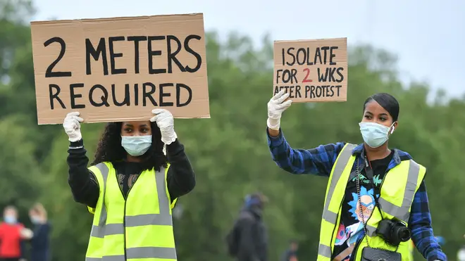 Protesters reminded each other to keep a 2m distance to adhere to coronavirus guidelines