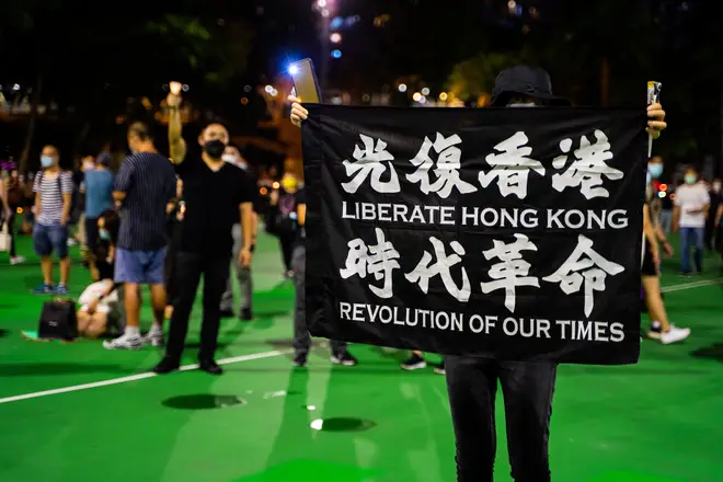Protesters held signs saying "Liberate Hong Kong" and "Revolution Of Our Times"