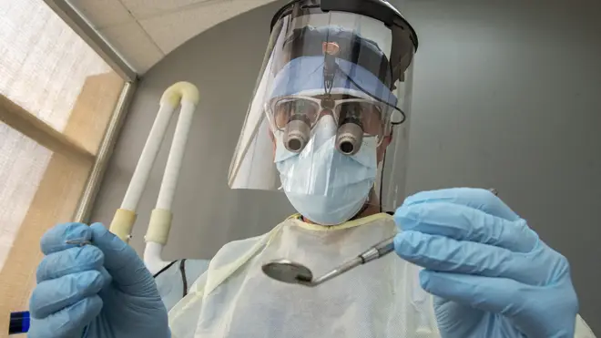 A dentist in full PPE (file image)