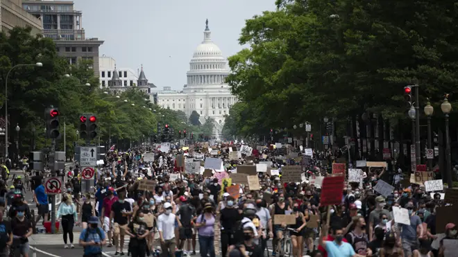 Protesters march near the Capitol Hill during a demonstration over the death of George Floyd