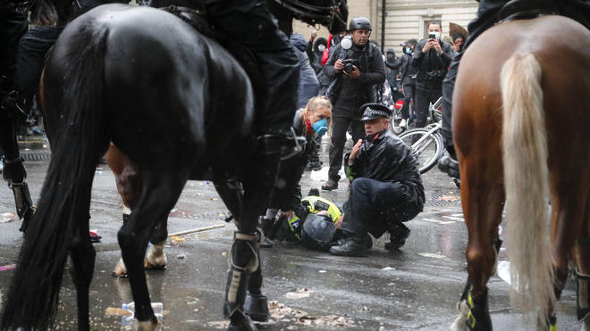 A mounted police officer was badly hurt after being thrown from her horse