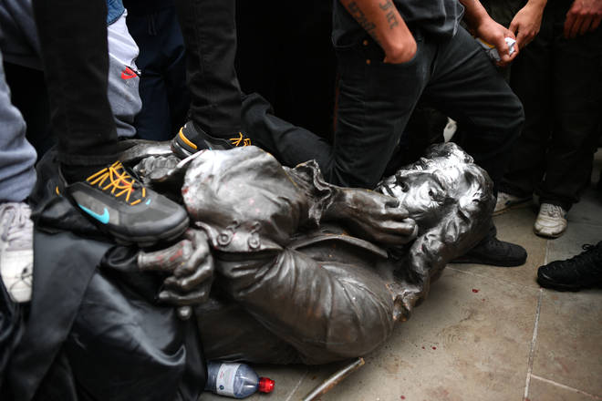 A statue of a 17th century slave trader was thrown into Bristol Harbour