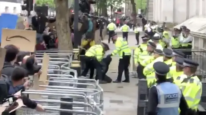 One person was arrested outside Downing Street after climbing over the barriers