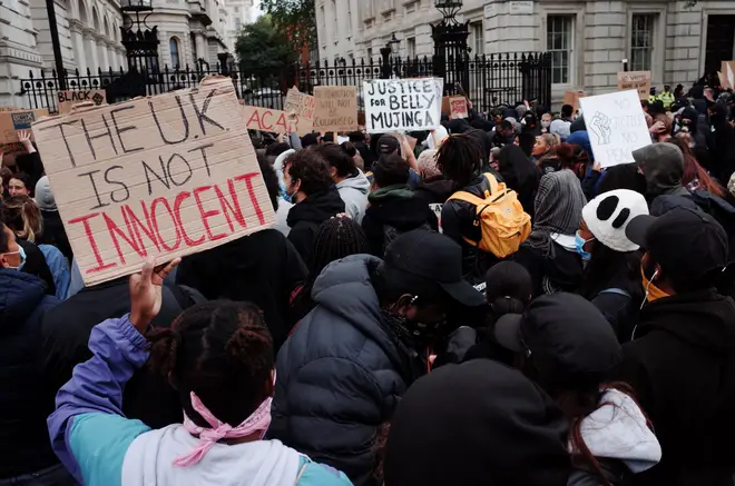Protesters gather outside Downing Street