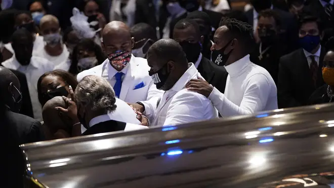 Family grieve together at George Floyd's casket
