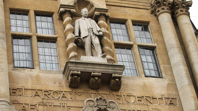 Cecil Rhodes statue stands at the front facade of the Oriel College in Oxford during the protest