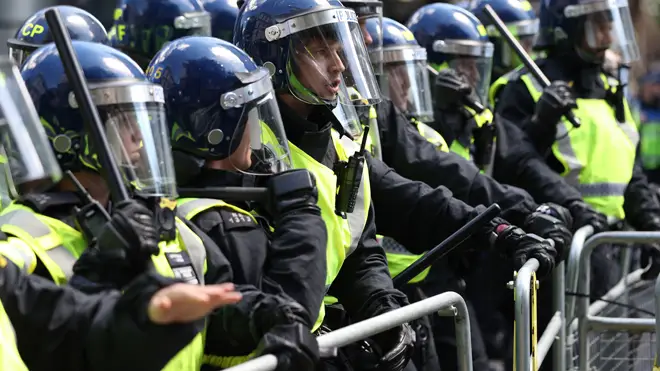 Police and protesters clashed in central London today