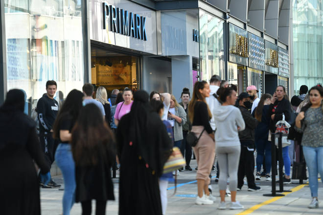 Huge queues gathered outside some shops ahead of them reopening