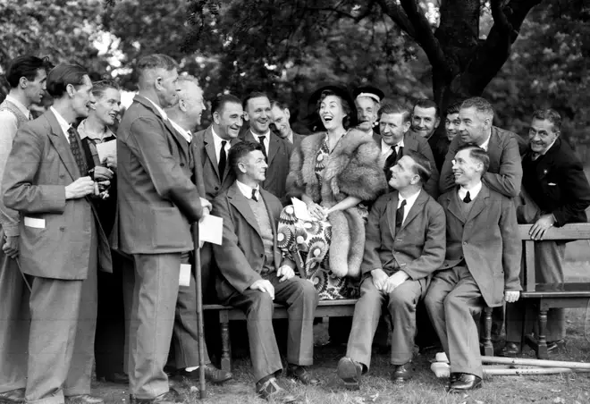 Vera Lynn with ex-servicemen during a Garden Party held by the Queen at Buckingham Palace in 1950