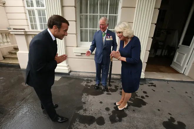The Prince of Wales and the Duchess of Cornwall greet French president Emmanuel Macron with a namaste gesture at Clarence House