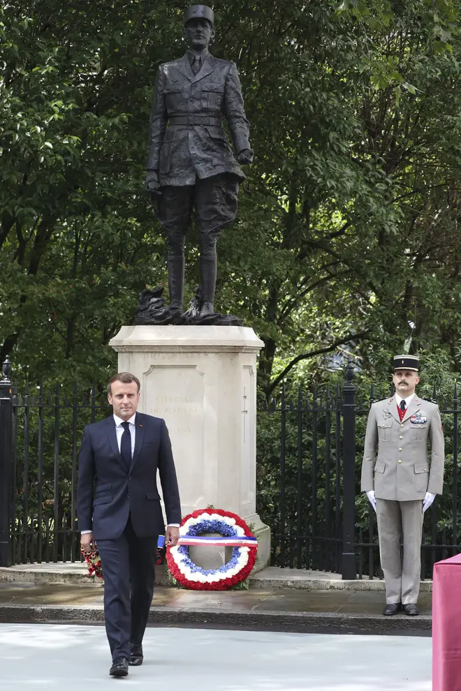 French President Emmanuel Macron lays a wreath at the foot of the statue of Charles de Gaulle