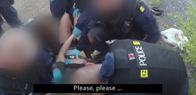 The shocking moment was caught on police video