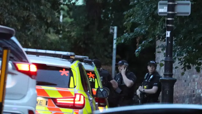 Police seen outside the area where multiple people were stabbed