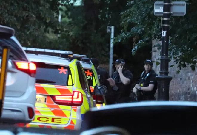 Police seen outside the area where multiple people were stabbed