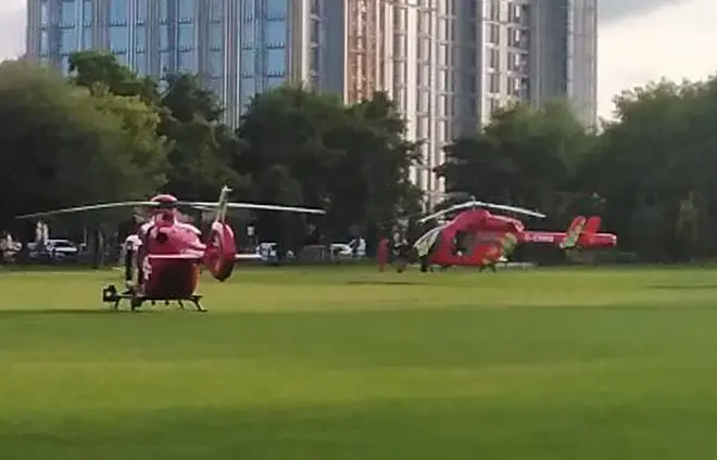 Two air ambulances in Kings Meadow in Reading after an incident at Forbury Gardens in Reading town centre