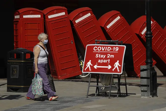 A sign requesting people stay two metres apart to try to reduce the spread of COVID-19 is displayed in Kingston upon Thames