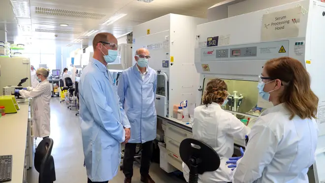 The Duke of Cambridge wears a mask as he meets scientists at the Oxford Vaccine Group's facility