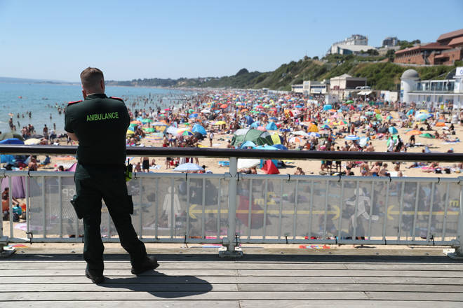 An ambulance crew member looking out over Bournemouth beach