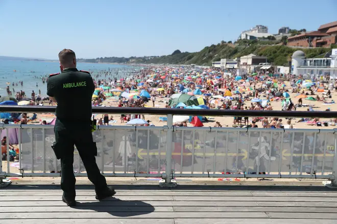 An ambulance crew member overlooking Bournemouth beach